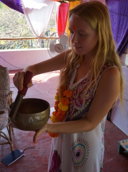 Students practice how to play tibetan singing bowls